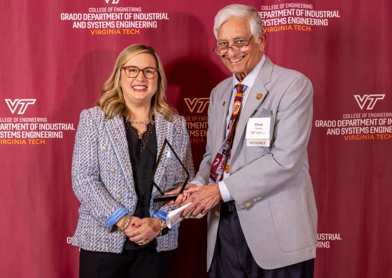 Vinod Chachra receives the Marvin H. Agee award from advisory board chair Elizabeth Dominicci Greer during the 2024 ISE banquet. 