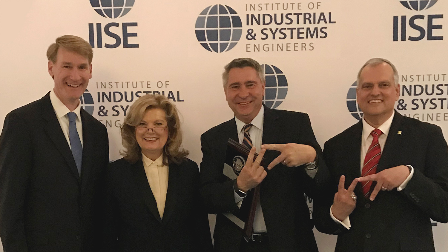 Don Taylor (second from right) with Joe Hartman (immediate past president IISE), Jamie Rogers (president-elect IISE), and Tim McGlothlin (president IISE) Don Taylor (second from right) with Joe Hartman (immediate past president IISE), Jamie Rogers (president-elect IISE), and Tim McGlothlin (president IISE)