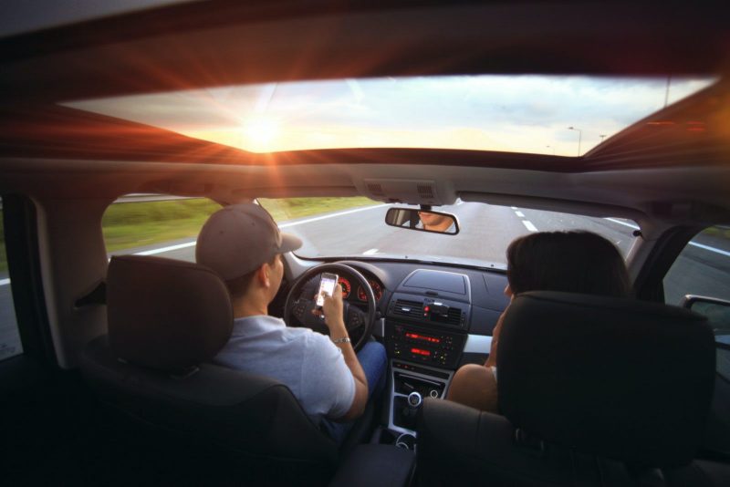 a person texting and driving